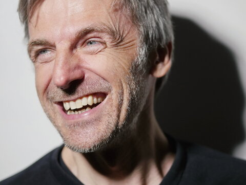 portrait middle-aged man laughing