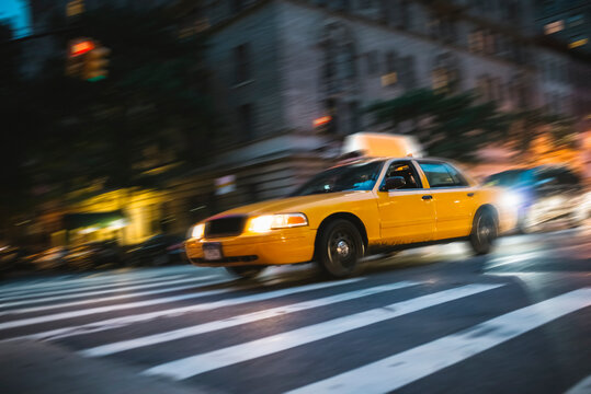 Fast cab running in Manhattan by night
