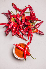 Dry Red Hot Chili Peppers over wooden background