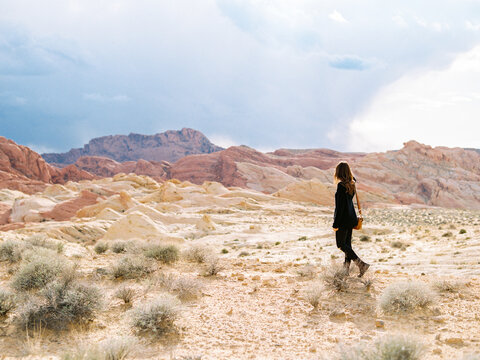 Young woman walking in desert