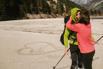 Heart in sand leads to passionate kiss