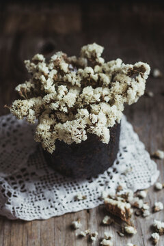 Dried flowers in rustic bowl