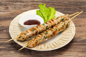 Minced pork skewer kebab with sauce