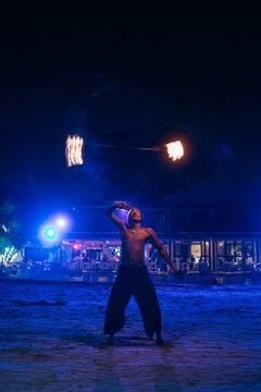 Fire Dancer On The Beach At Night