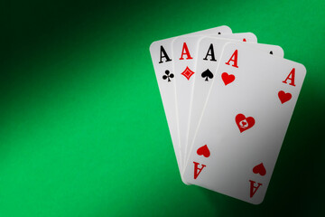 four aces on green background