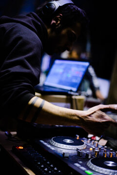 Male Hardcore DJ at a rave party