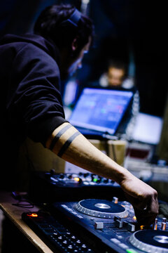 Male Hardcore DJ at a rave party