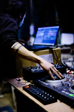 Male Hardcore DJ at a rave party