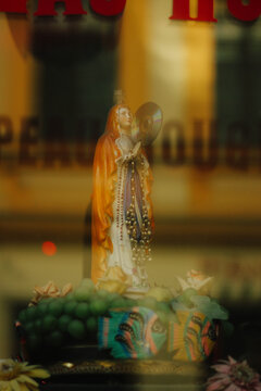 Little statue of Holy Mother with music disk