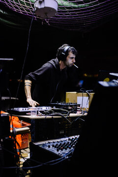 Male Hardcore DJ at a rave party