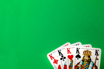 four of kings on green background