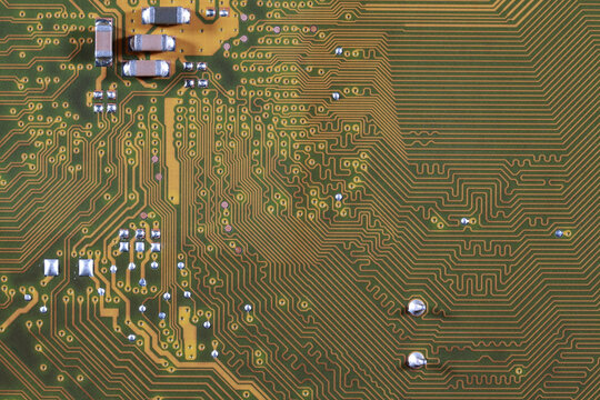 close-up of electronic circuit golden board background of computer motherboard.