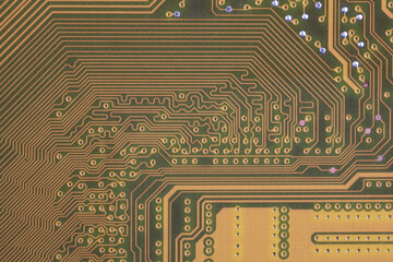 close-up of electronic circuit golden board background of computer motherboard.