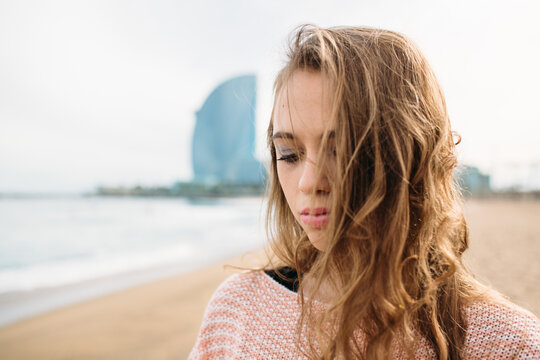 Portrait of beautiful young woman on the beach