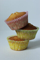 Sweet dessert three cupcakes is made up of a pyramid .Texture or background