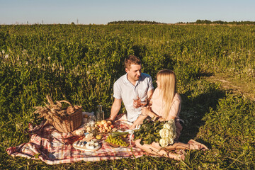 Naklejka na ściany i meble Man and woman together in picnic outdoors