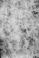 The concrete wall is gray spattered with black paint . Texture or background