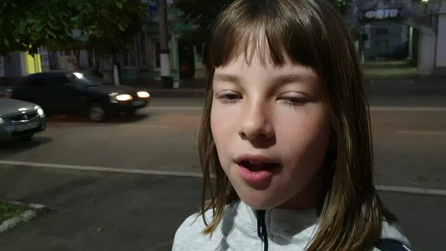 Beautiful teen girl inflating bubble of chewing gum. Moderm fashion girl.