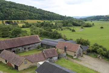 Old farm buildings nestled into the picturesque Onny Valley in Shropshire, England, UK.