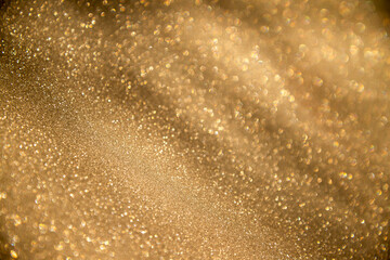 abstract defocused lights, sparkling holiday bokeh background with golden tones, elegant christmas backdrop