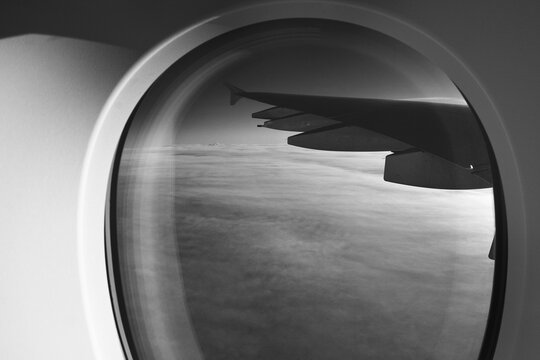 Amazing view through airplane window onto the wing