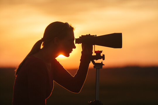 Woman With Binoculars BirdWatching on Marsh