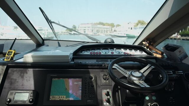 yacht with instruments and steering wheel the hands of the captain. Close up. speedboat or luxury yacht ship. navigation. man steering