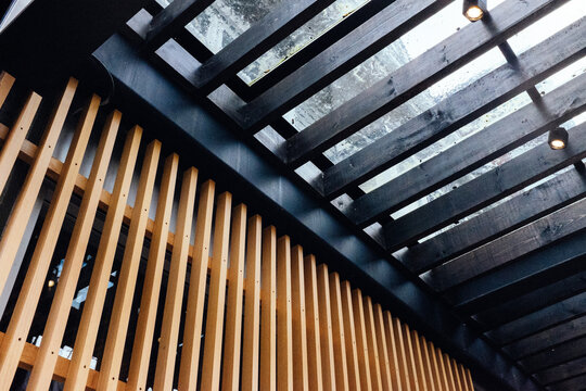 A view underneath a modern awning or trellis.