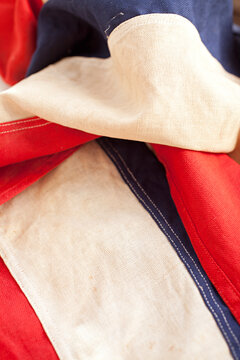 close up of old nautical flag - red white blue