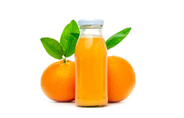 Orange juice in glass bottles with two oranges and leaf on white background.