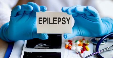 text EPILEPSY write on a medicine card. Medical concept with a stethoscope and pills