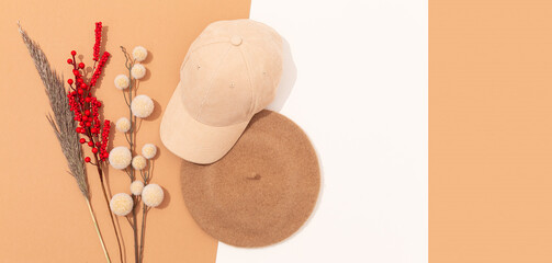Fototapeta na wymiar Stylish autumn accessories flat lay. Hats. .Beret and cap. Fall winter fashion concept. Design beige background. Copy space