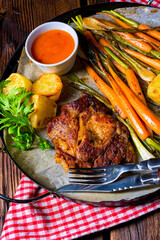 grilled neck chops with caramelized vegetables.