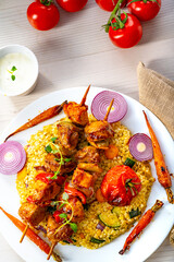 Shish kebabs with vegetables and bulgur