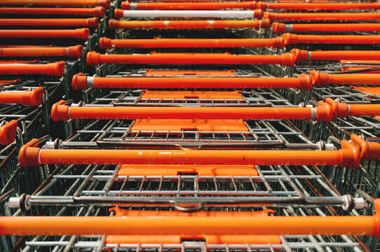 Orange Shopping Cart Parked In A Row