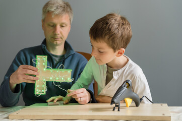Boy switches on the lights fixed to his homemade object