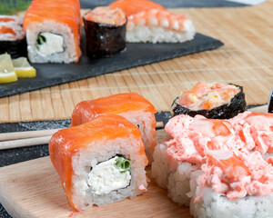 Sushi set. Japanese sushi, rolls, soy sauce, ginger, chopsticks