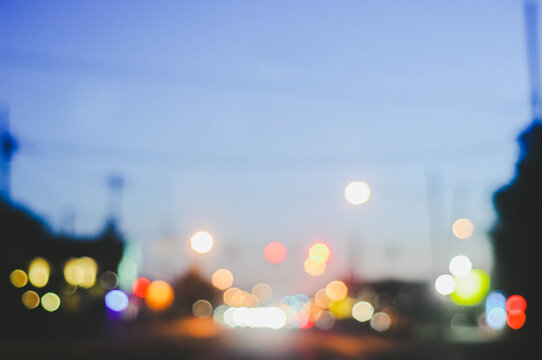 Out of focus traffic lights at sunset in the summer