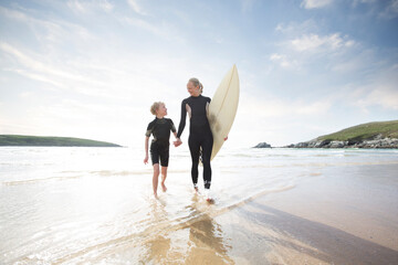 Mother and Son surfing together.