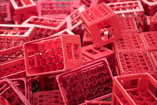 Pile of red plastic crates