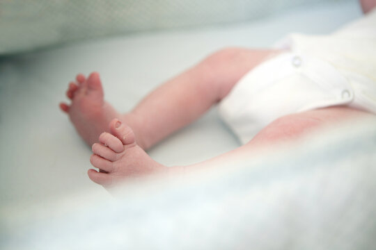 Newborn's Legs and Peeling Feet