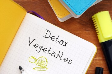 Healthy concept about Detox Vegetables with inscription on the sheet.