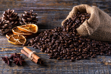 Coffee beans fragrant aromatic on a wooden table. Morning coffee concept.