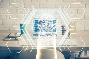 Computer on desktop in office with finger print drawing. Double exposure. Concept of business data security.