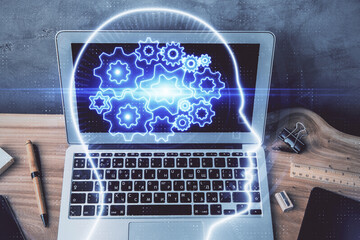 Multi exposure of work space with computer and human brain hologram. Brainstorm concept.