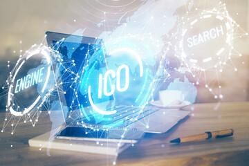 Double exposure of blockchain theme hologram and table with computer background. Concept of bitcoin crypto currency.