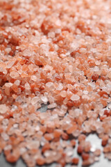 Fototapeta na wymiar close up a pile of Himalayan pink salt in natural light