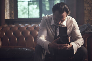 cinematic photo shoot of the confident actor celebrity look in foggy loft room