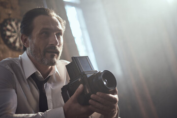cinematic photo shoot of the confident actor celebrity look in foggy loft room