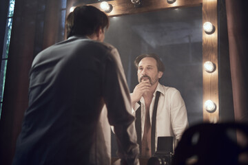 cinematic photo shoot of the confident actor celebrity look in foggy loft room